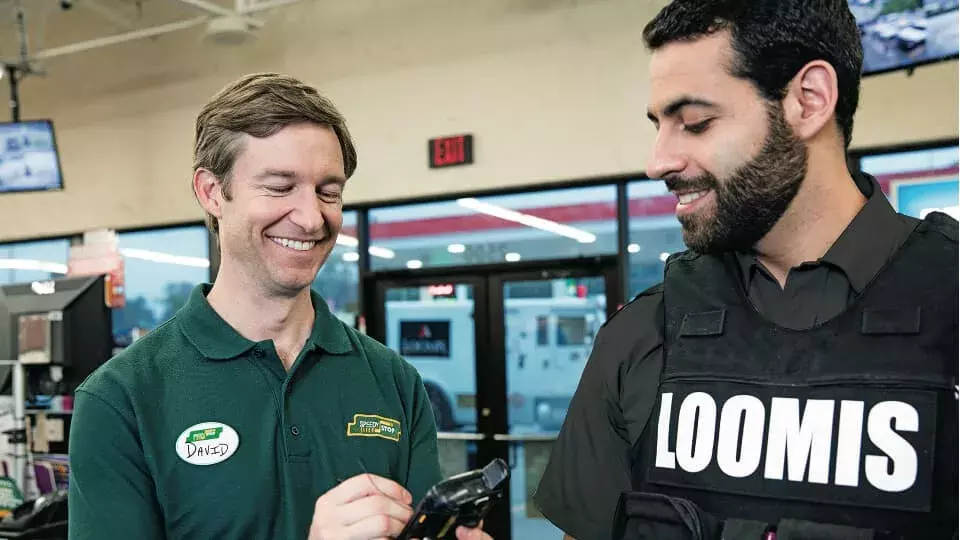 Shop owner and a Loomis guard