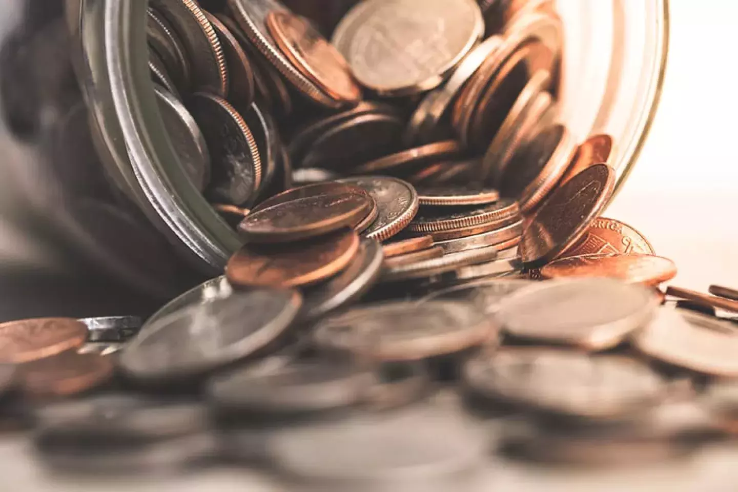 Spilled jar of coins