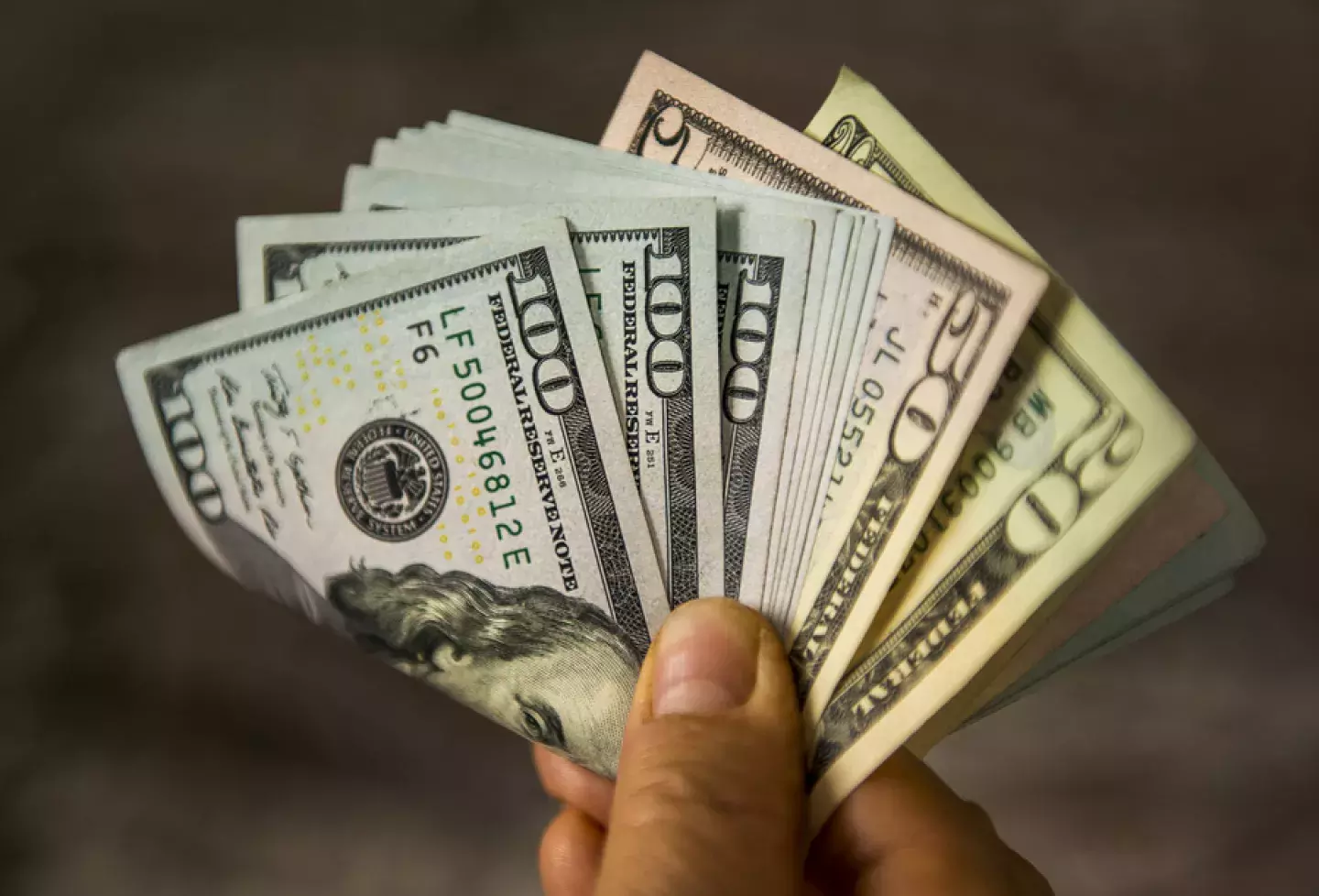 Handful of cash bills